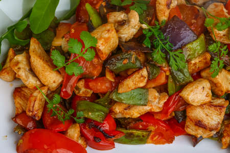 Stir fried chicken with vegetables, herbs and spicesの写真素材