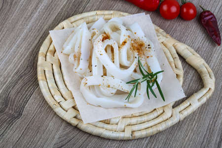 Raw squid rings with herbs - ready for cookingの写真素材
