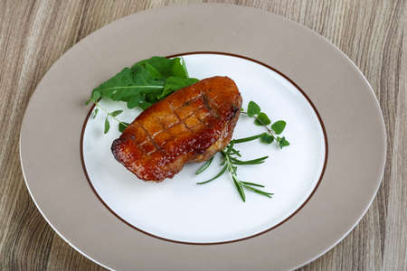 Roasted duck breast with rosemary and rucola leavesの写真素材