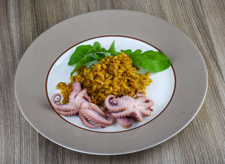Seafood risotto with octopus, cheese and thyme leafの写真素材