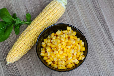 Sweet canned fresh corn on the wood backgroundの写真素材