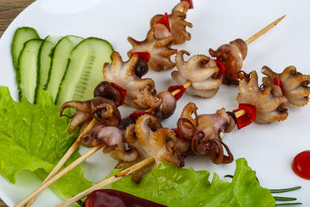 Barbecue baby octopus with bell pepper and spicesの写真素材