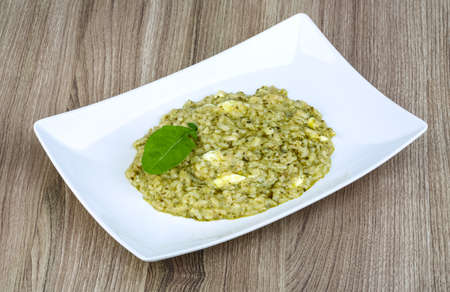 Risotto with pesto, ruccola leaf and soft cheeseの写真素材