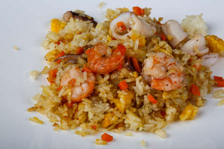 Asian traditional Fried rice with seafood on the wood backgroundの写真素材