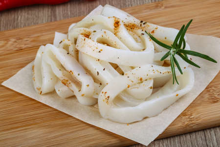 Raw squid rings with herbs - ready for cookingの写真素材