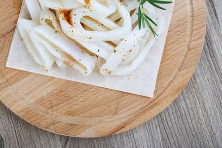 Raw squid rings with herbs - ready for cookingの写真素材