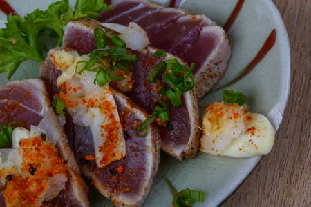 Roasted Tuna steak weeth salad in the wood backgroundの写真素材