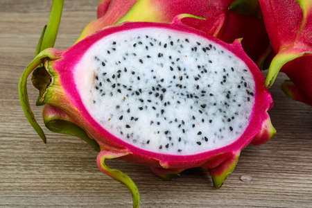 Tropical - Dragon Fruit sliced on the wood backgroundの写真素材