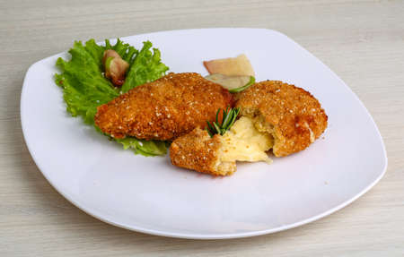 Fried cheese sticks in pan with rosemaryの写真素材