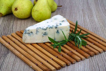 Blue cheese with rosemary and green pearの写真素材