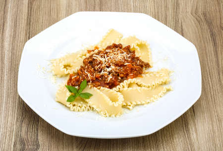 Pasta Bolognese with parmesan cheese and basil leavesの写真素材