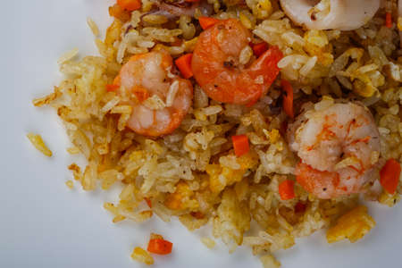 Asian traditional Fried rice with seafood on the wood backgroundの写真素材