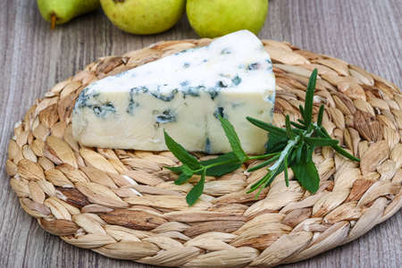 Blue cheese with rosemary and green pearの写真素材
