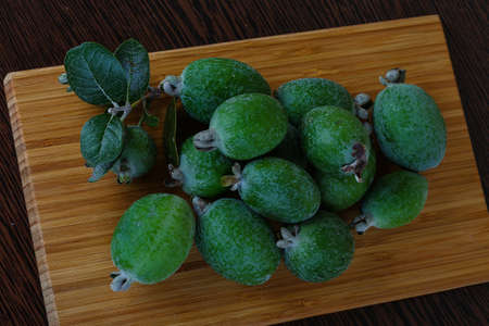 Fresh ripe sweet Feijoa fruit with leavesの写真素材