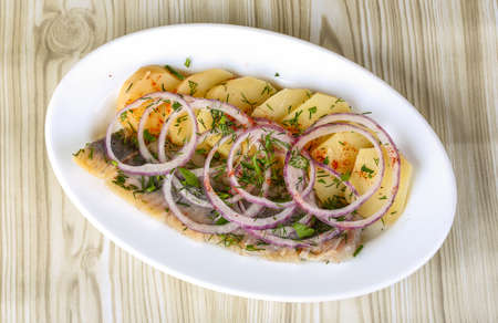 Herring with potato and onion - traditional appetizer snackの写真素材