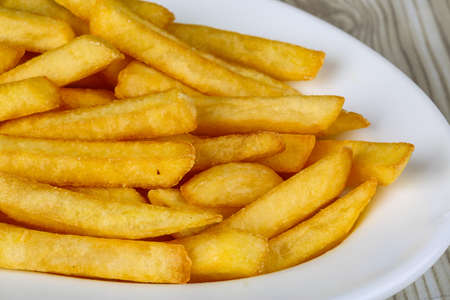 Hot fresh French fries snack in the plate