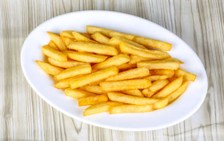 Hot fresh French fries snack in the plate
