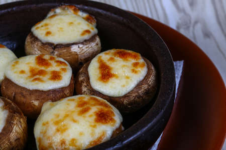 Baked Stuffed champignon with hard cheese and spicesの写真素材