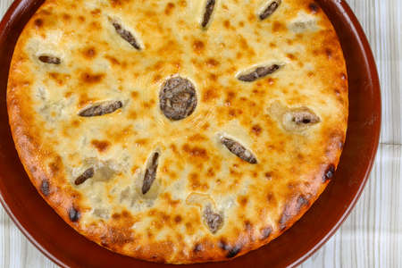 Oriental pastry - fresh hot Ossetian pie in the plateの写真素材