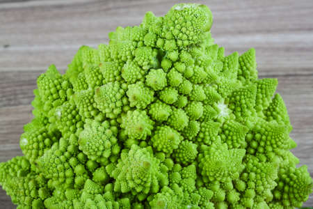 Romanesco exotic cabbage on the wood backgroundの写真素材