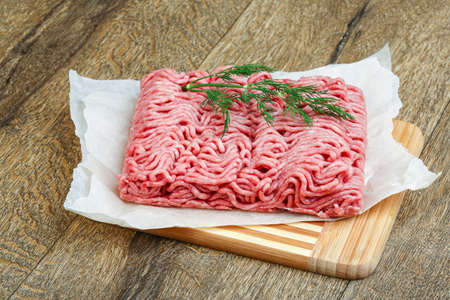 Raw minced beaf meet on the wood background