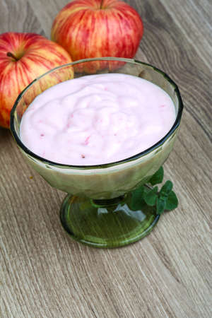 Fresh cold Srawberry yoghurt on the wood backgroundの写真素材