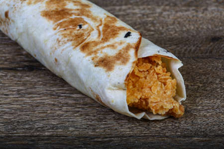 Chicken roll with vegetables on the wood backgroundの写真素材