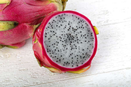 Fresh ripe sweet dragon fruit on the wood backgroundの写真素材