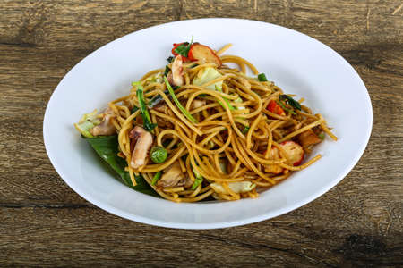 Asian style pasta with seafood on banana leafの写真素材