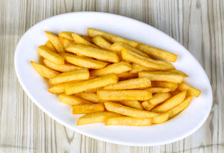 Hot fresh French fries snack in the plate