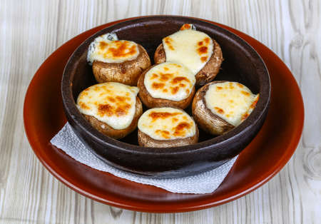Baked Stuffed champignon with hard cheese and spicesの写真素材