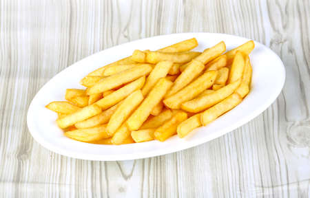 Hot fresh French fries snack in the plate