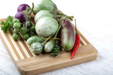 Fresh ripe Baby eggplans on the wood backgroundの写真素材