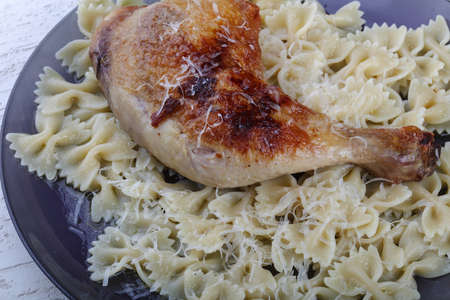 Chicken legs with makaroni and parmesan cheeseの写真素材