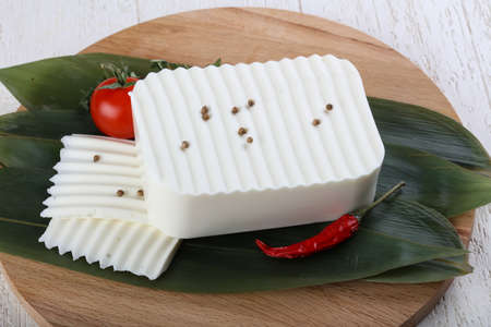 Feta cheese on the bamboo leaves  with thyme and corianderの写真素材