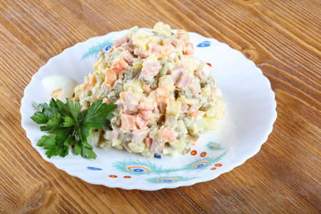 Famous Russian salad with parsley and eggsの写真素材