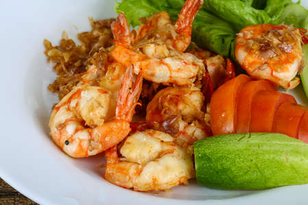 Grilled shrimps with garlic and herbsの写真素材