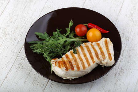 Grilled chicken breast with rucola and thymeの写真素材