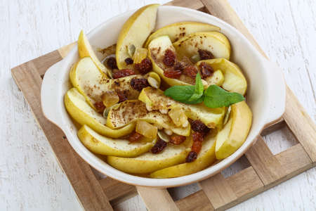 Baked apple with cedar, raisin and mintの写真素材