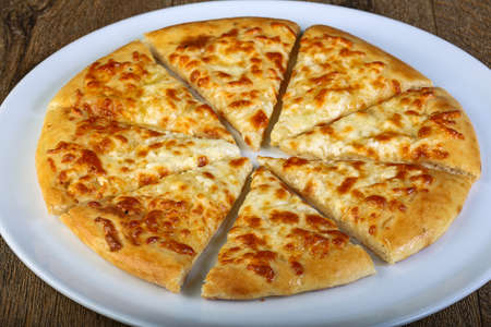 Sliced Cheese bread in the white plateの写真素材