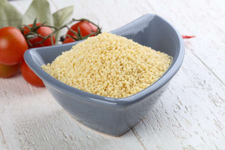 Raw millet in the bowl ready for cookingの写真素材
