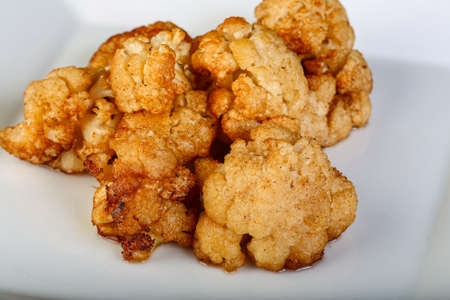 Baked cauliflower in the white plateの写真素材