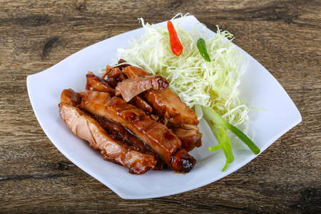 Teriyaki chicken with herbs and spices served cabbageの写真素材