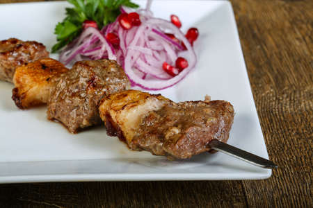 Grilled lamb bbq with herbs, onion and spicesの写真素材