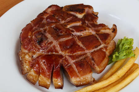 Baked pork leg with herbs and spicesの写真素材