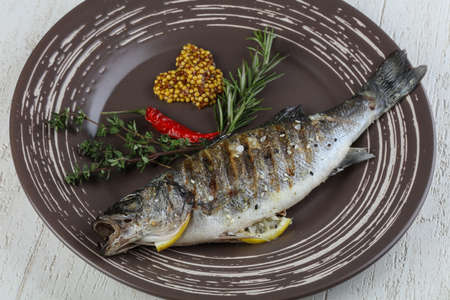 Grilled seabass with mustard, thyme and rosemaryの写真素材