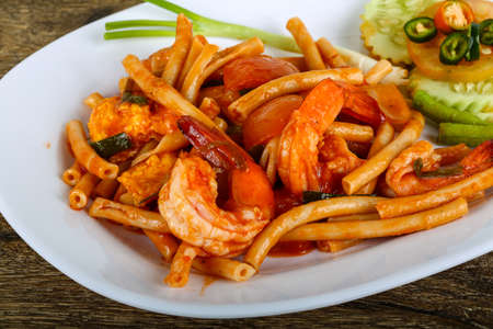 Spicy Pasta with seafood with herbs and spicesの写真素材