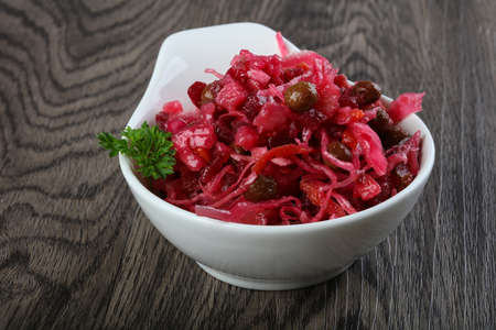 Viniagrette russian salad served parsley on wood backgroundの写真素材