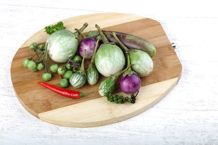 Fresh ripe Baby eggplans on the wood backgroundの写真素材