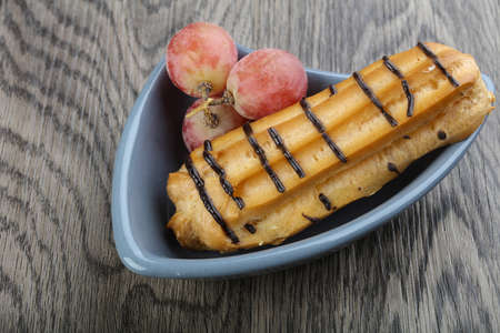 Fresh sweet shugary eclair with creamの写真素材